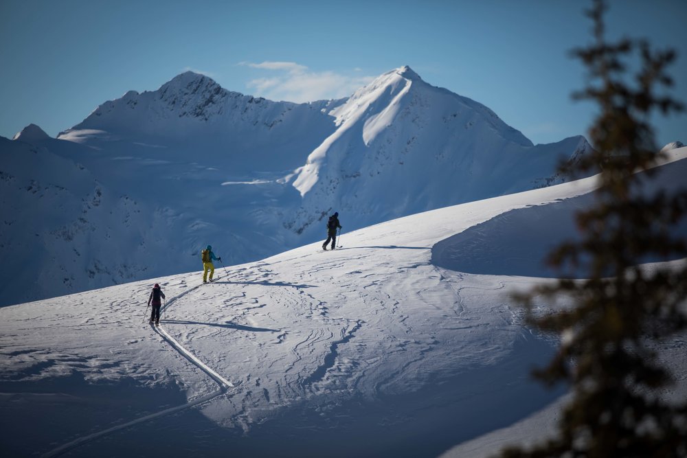 Alex Yoder, Leah Evans, Marie France-Roy ski touring at sunrise lodge.
